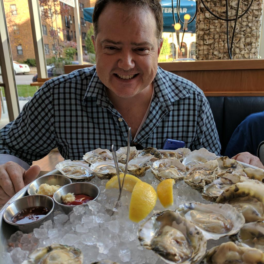 mike eyeballing dozens of oysters.jpg