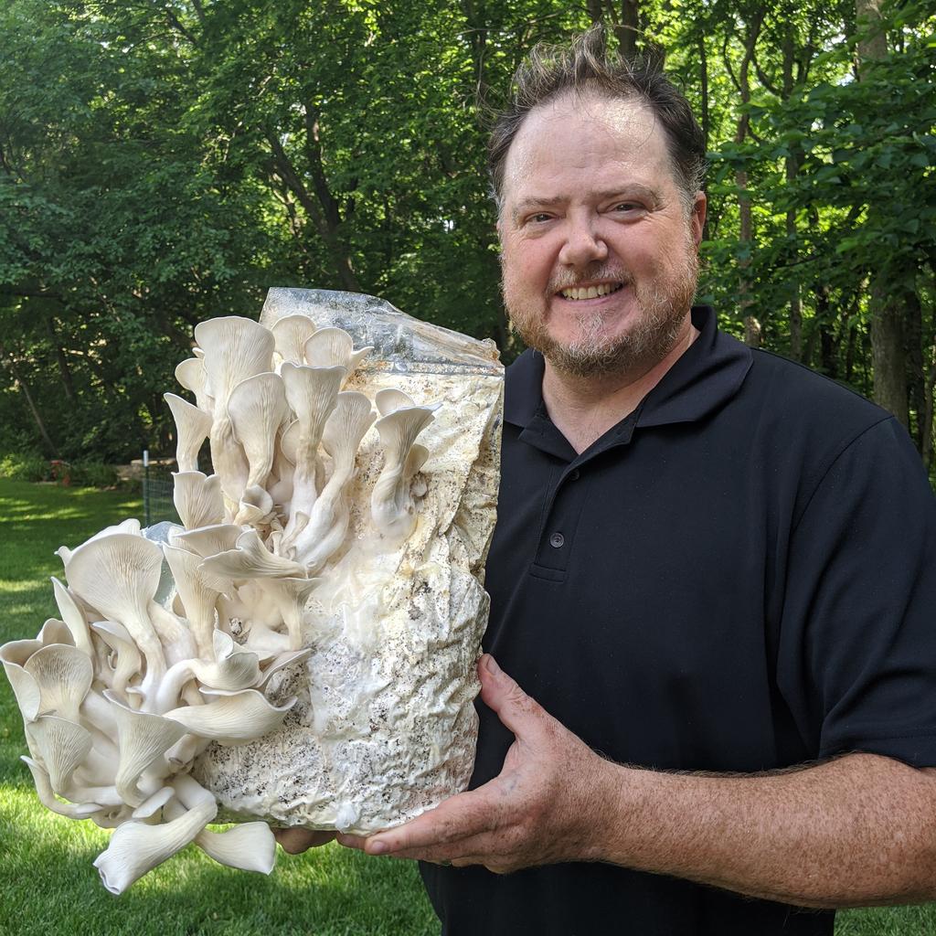 mike growing oyster mushrooms.jpg