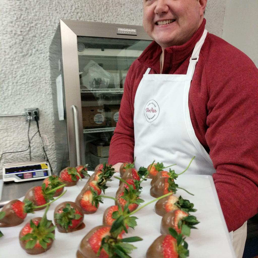 mike making chocolate covered strawberries.jpg