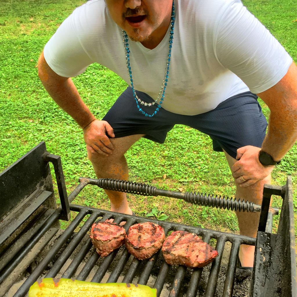 mike outside cooking on a grill.jpg